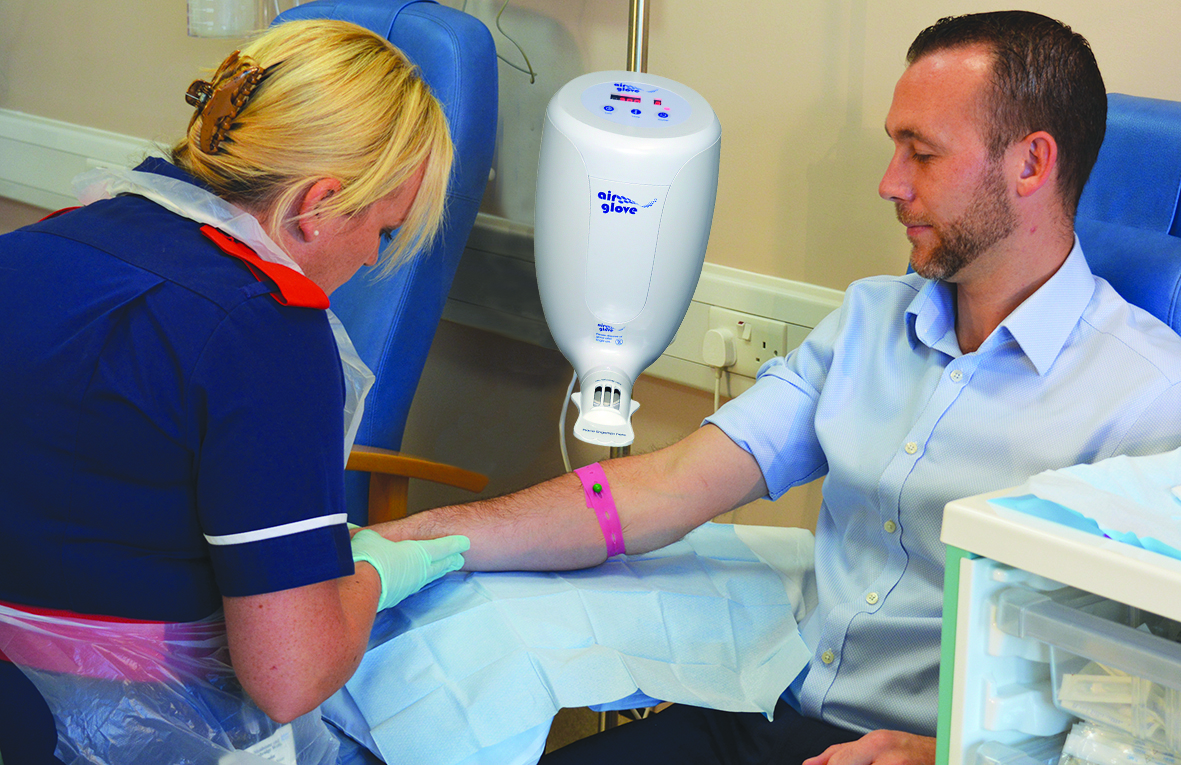 A nurse and a patient with the Airglove device in use